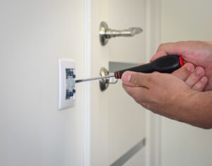 electrician repairing household socket, switch. electrical repair