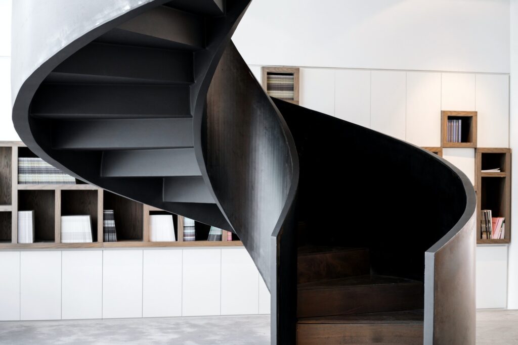 Spiral staircase against the bookshelf