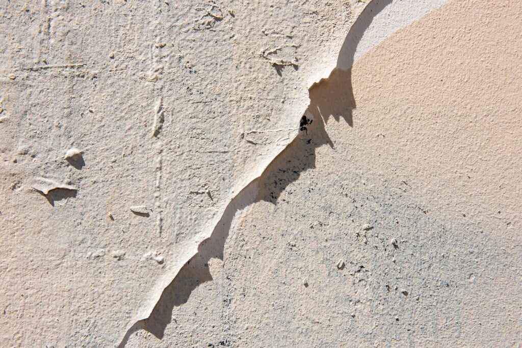 cracked paint on white wall