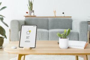 Digital tablet screen with smart home controller on a wooden table
