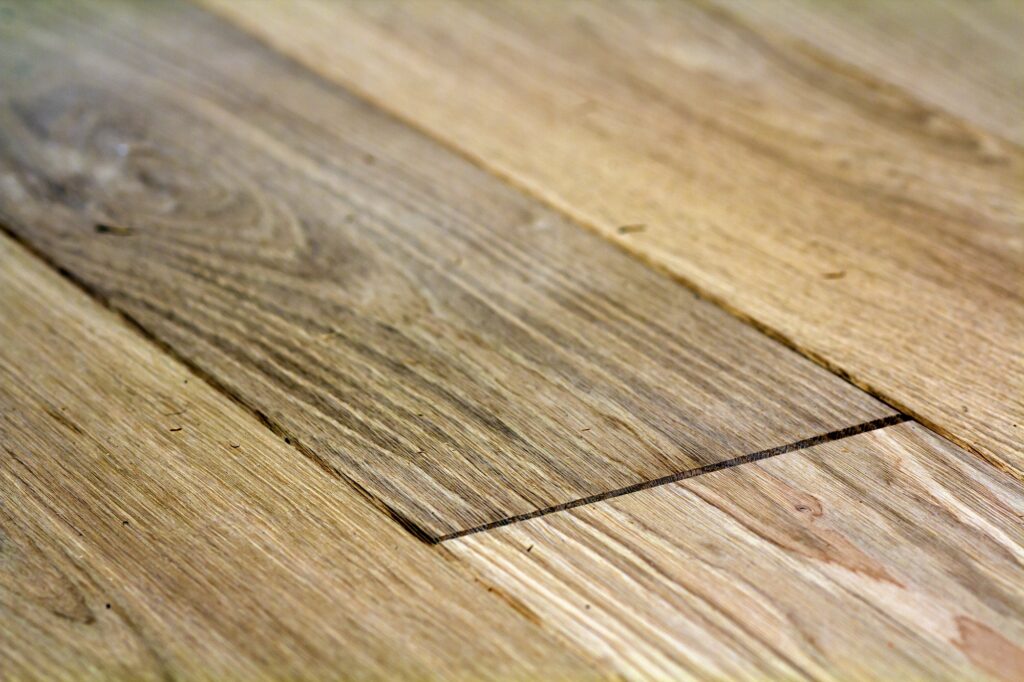 Natural light brown wooden parquet floor boards.