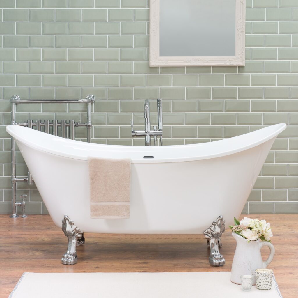 Oval bathtub in a bathroom with laminate flooring in a loft style house