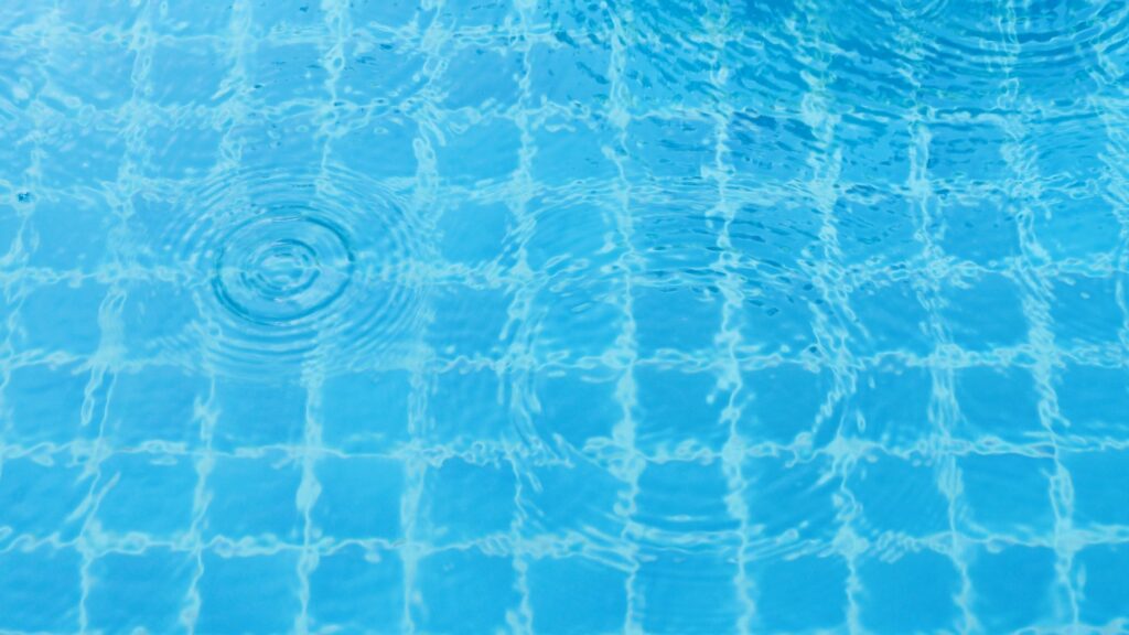 Rain drops on the swimming pool.