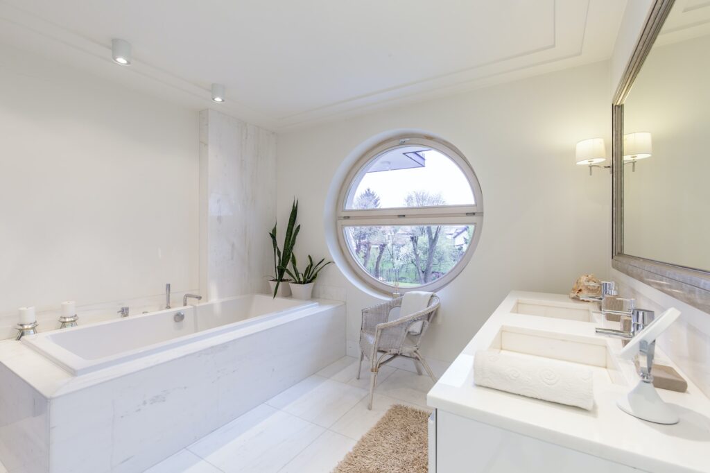 Bright bathroom with round window