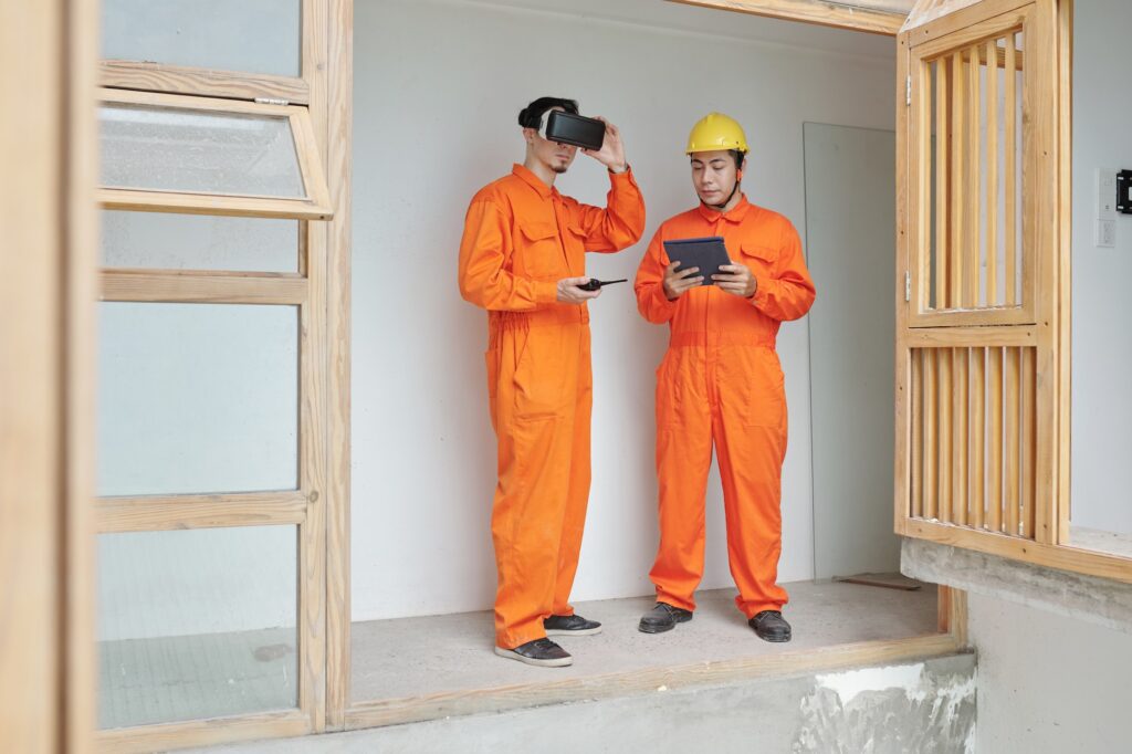 Construction Workers Checking Thermal Insulation