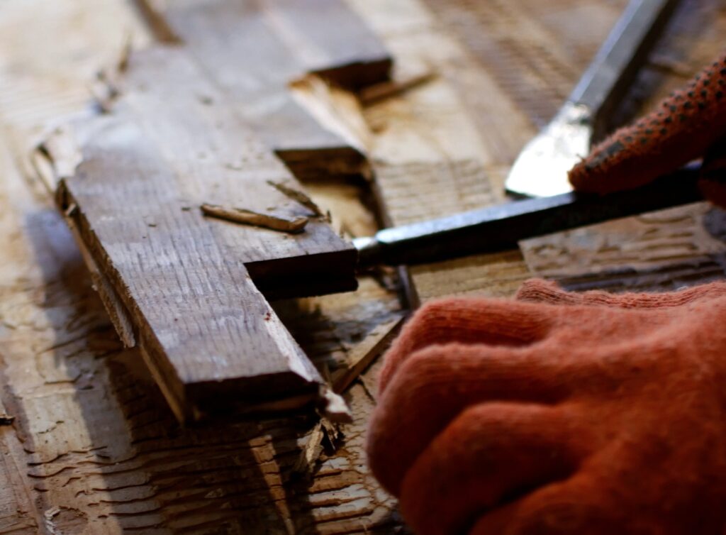 Manual dismantling of old wooden parquet