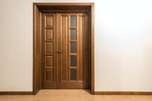 New brown wooden door in house interior