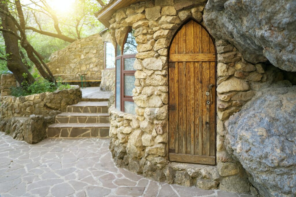 Old house door in forest.