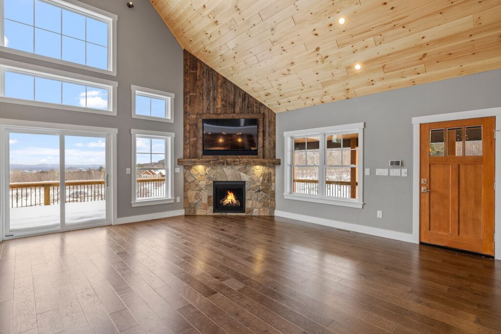 Stunning room with elegant wood flooring and large windows