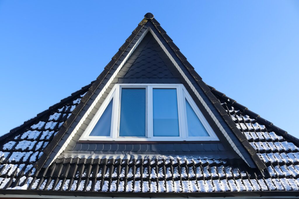 Triangular rooftop room window from outside