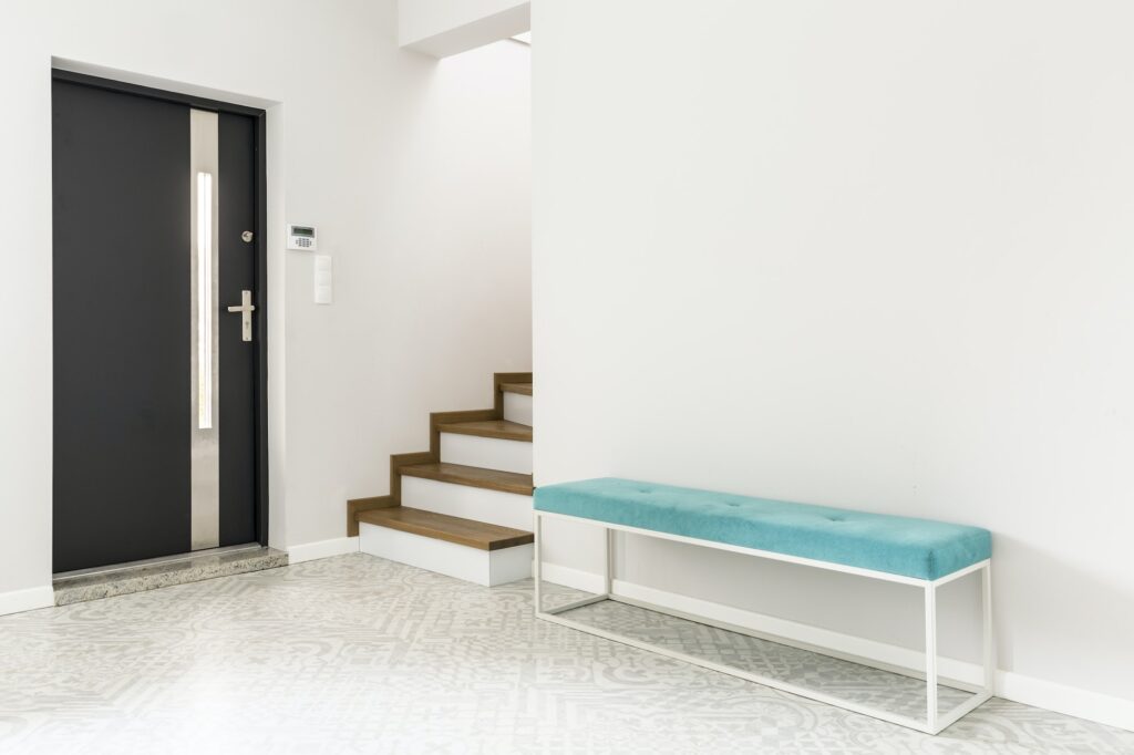 White entrance interior with bench